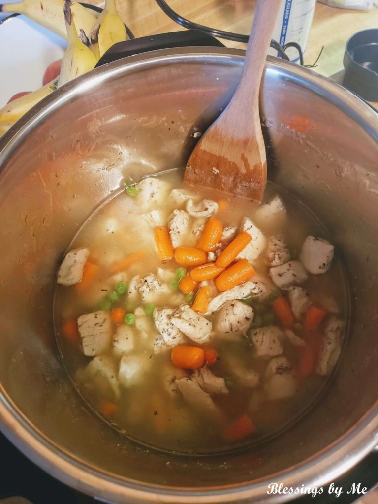 Stir in ingredients - instant pot chicken & dumplings