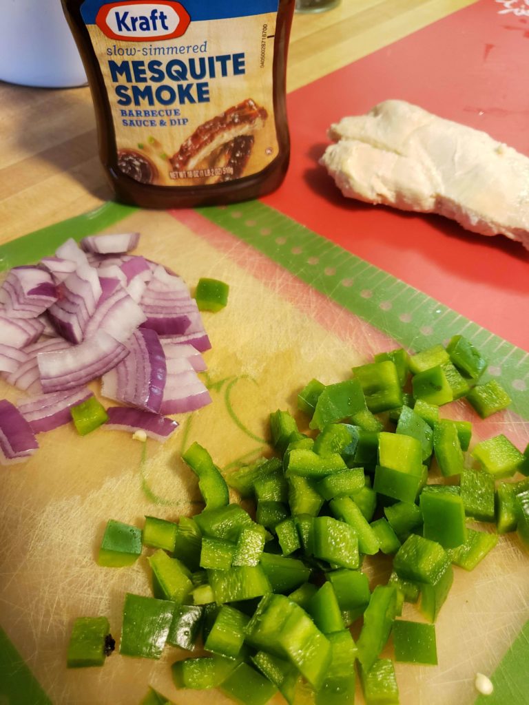 Dice the peppers and onions for the BBQ Chicken Pizza