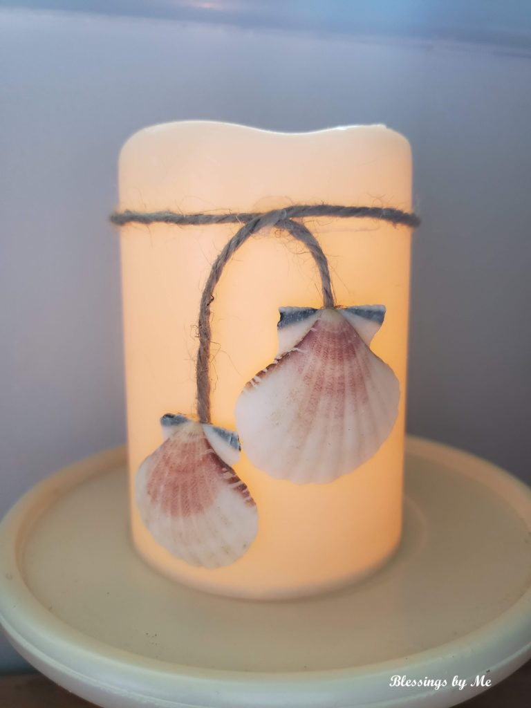 completed seashell candle