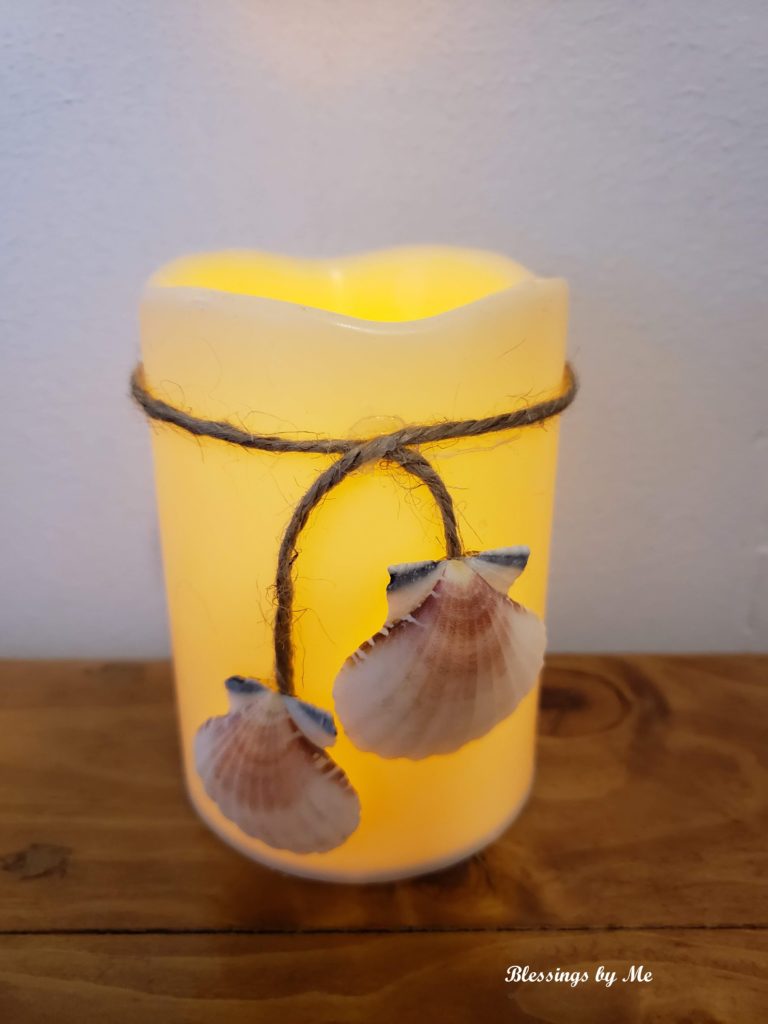 lit seashell candle