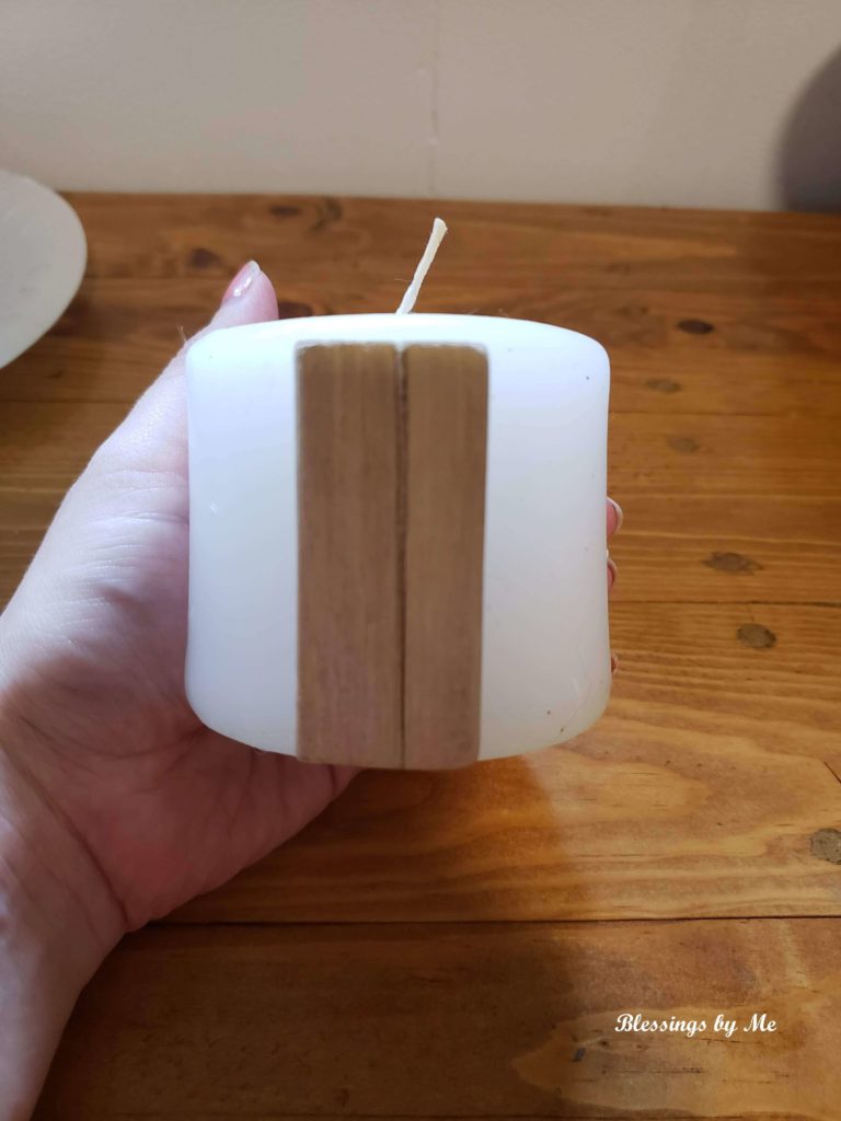 step 1 - glue driftwood onto candle