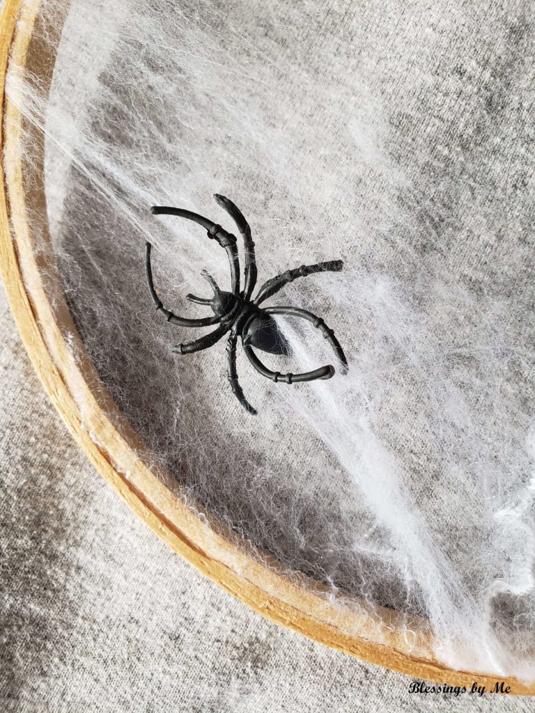 place spiders on the cobweb wreath