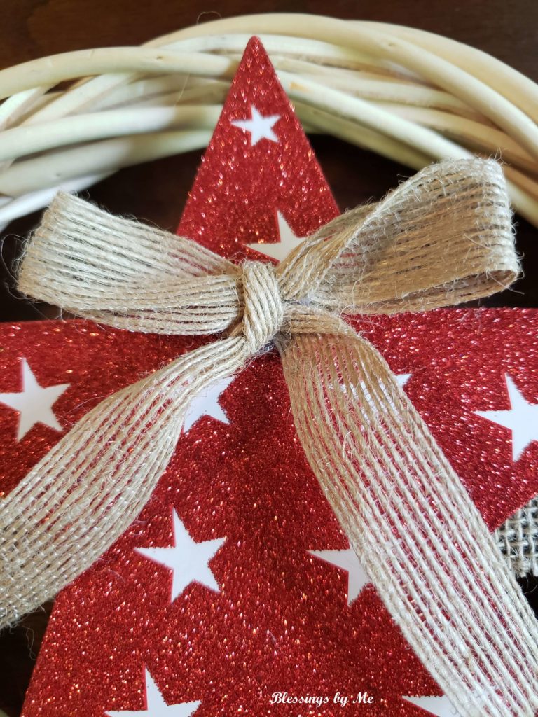 glue the burlap bow to the star