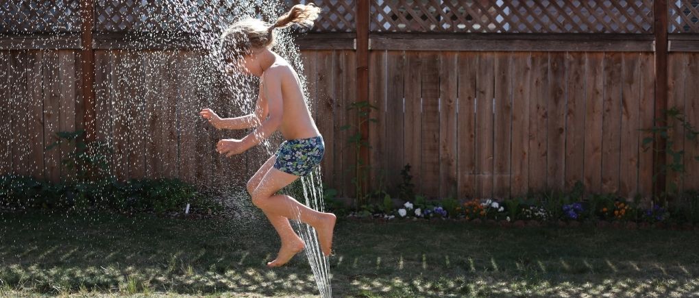 kid playing in water