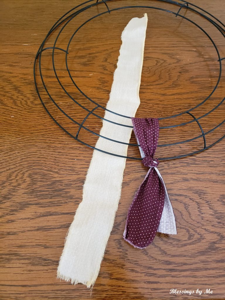 lay the fabric strip under the wreath wrong side up