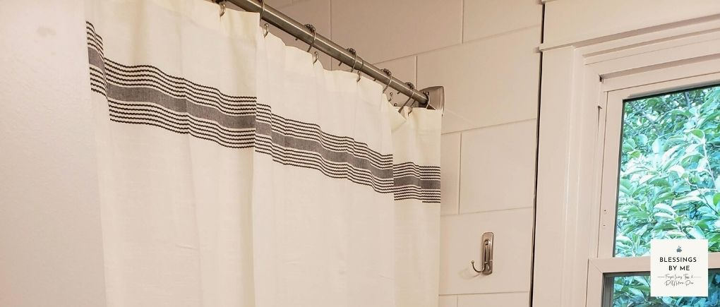 hang a new shower curtain
